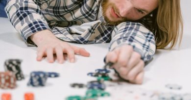 Man Lying on the Floor with Casino Chips