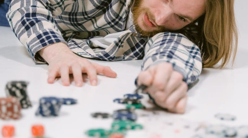 Man Lying on the Floor with Casino Chips