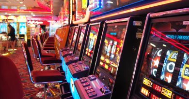 arcade machine with red and white chairs